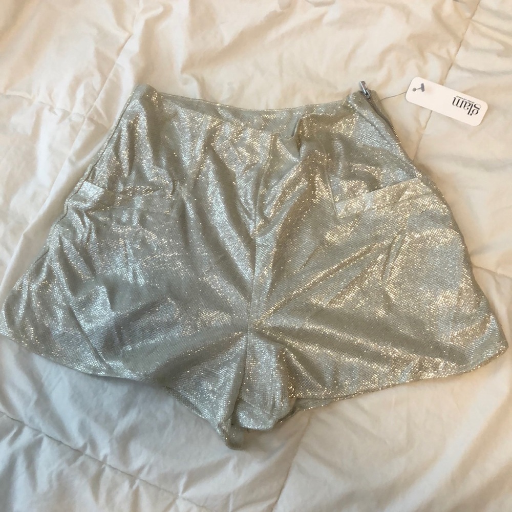 High waisted sparkly- silver shorts.